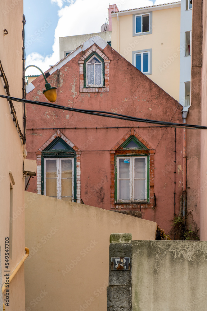 Facades of old residential houses in the streets of old Lisbon