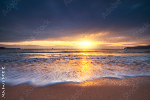 Fototapeta Naklejka Na Ścianę i Meble -  Beautiful sunrise over the sea and beach
