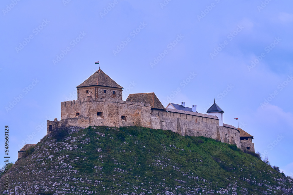 Sümeg castle at the top of the hill against blue cloudy sky