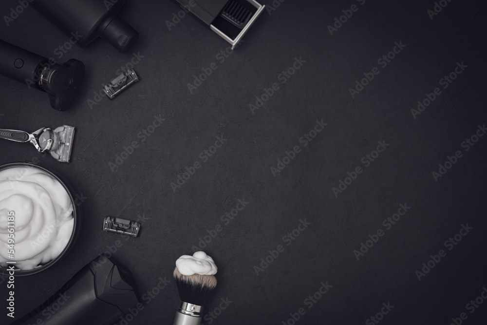 A set of items for shaving a beard on a black background.