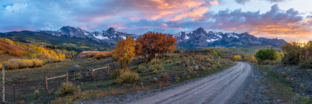 Sunset in Rocky Mountains - Autumn golden aspen foliage near Ridgway Colorado - County Road 9 - on the RR Ralph Lauren ranch  - obrazy, fototapety, plakaty 