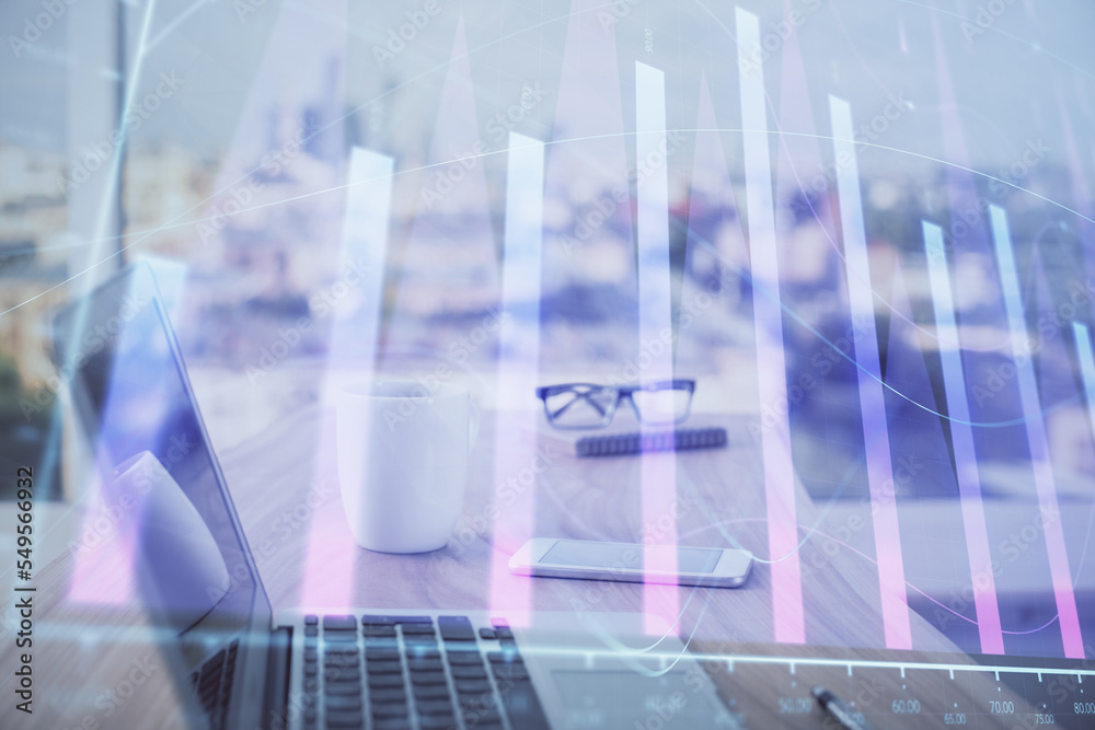 Forex graph hologram on table with computer background. Multi exposure. Concept of financial markets. Forex graph hologram on table with computer background. Multi exposure. Concept of financial markets.