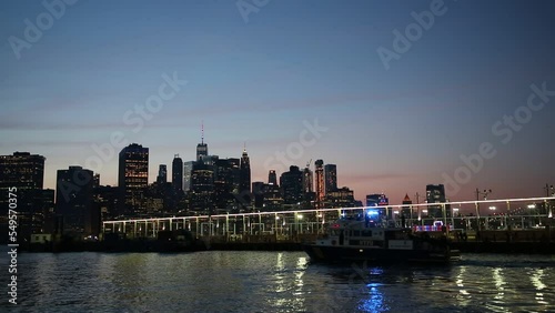 Police boat and panoramic view of downtown Manhattan and Hudson river in New York City, USA