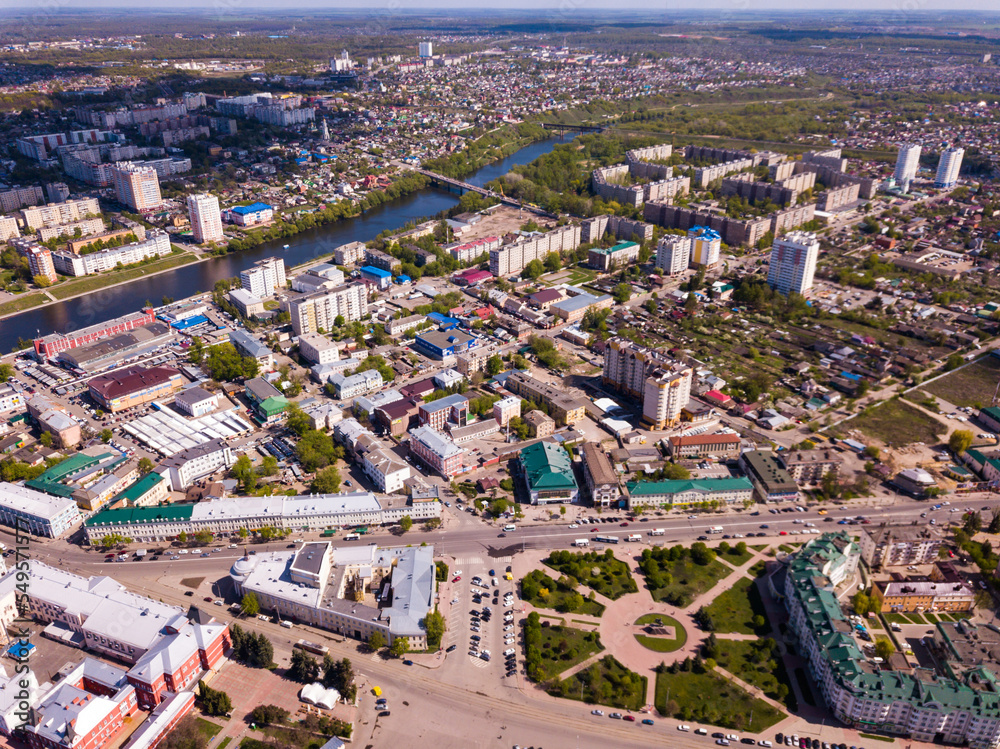 Aerial view of modern cityscape of old Russian town of Oryol located on banks of Orlik River in springtime..