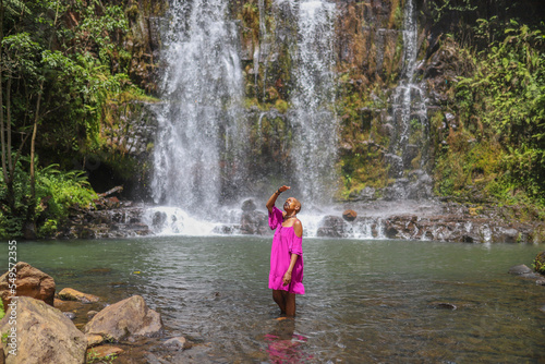 Black girl in the waterfall