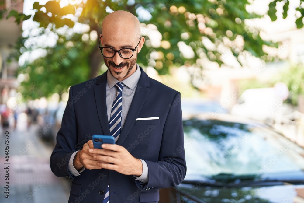 Young hispanic man executive smiling confident using smartphone at street Young hispanic man executive smiling confident using smartphone at street