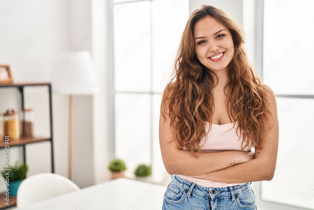 Young beautiful hispanic woman smiling confident standing with arms crossed gesture at home Young beautiful hispanic woman smiling confident standing with arms crossed gesture at home
