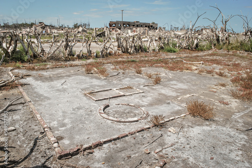 Abandoned city. Destroyed and ruined city. Ghost town. Ruined houses. Desolate landscape.