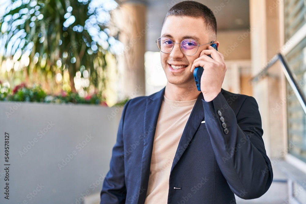 Young hispanic man executive smiling confident talking on smartphone at street Young hispanic man executive smiling confident talking on smartphone at street