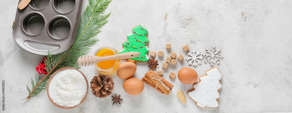 Ingredients for Christmas bakery and kitchen utensils on light background Ingredients for Christmas bakery and kitchen utensils on light background