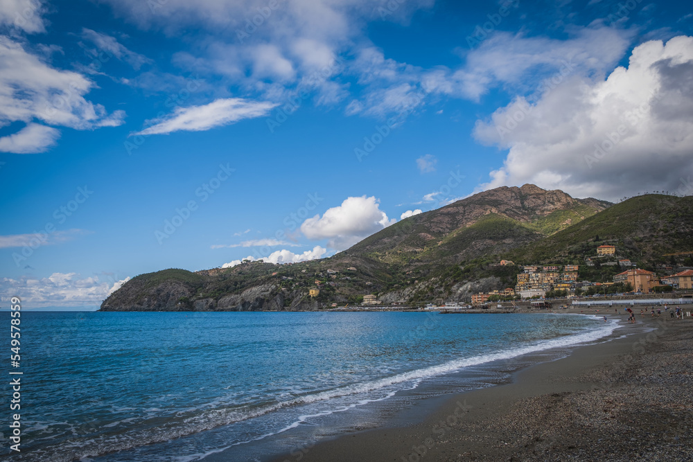 Levanto colorful village Italy, colorful beach with an umbrella during the autumn holiday. Levanto, Cinque Terre, Italy, September 2022