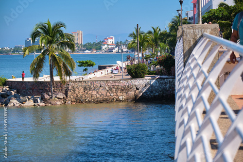 Puerto Vallarta beach walkway with palm trees and sea
