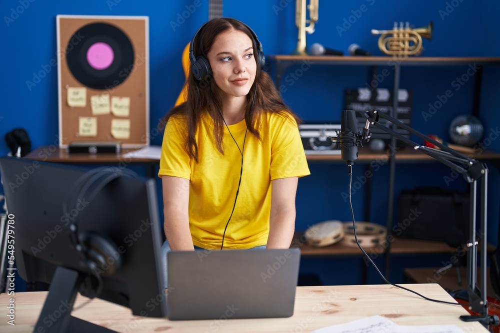 Young woman musician having dj session at music studio Young woman musician having dj session at music studio