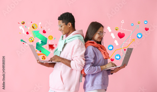 Young couple with laptops c...