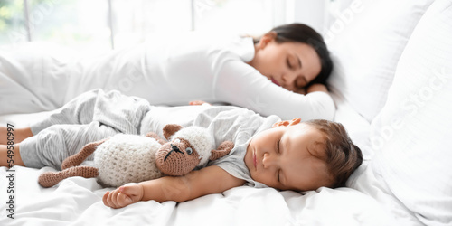 Adorable baby with toy and ...
