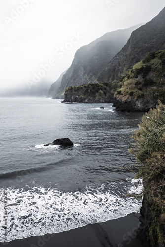 Magnisificat cloudy sunrise atmosphere on Seixal beach photographed in the morning. Seixal beach, Madeira Island, Portugal, Europe. photo