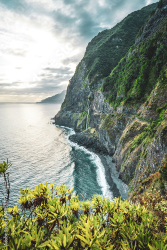 Waterfall flowing into the sea in a picturesque morning atmosphere. Viewpoint V  u da Noiva  Madeira Island  Portugal  Europe.