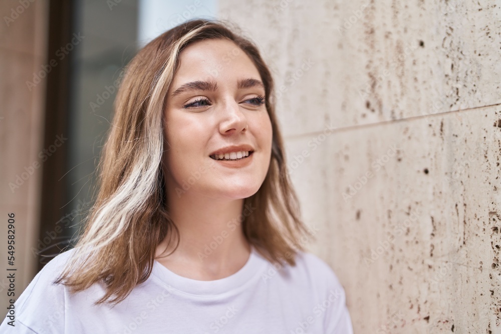 Young woman smiling confident standing at street Young woman smiling confident standing at street