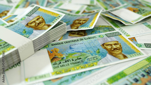 close up of Djiboutian franc notes spread on table. 3d rendering of money scattered on surface