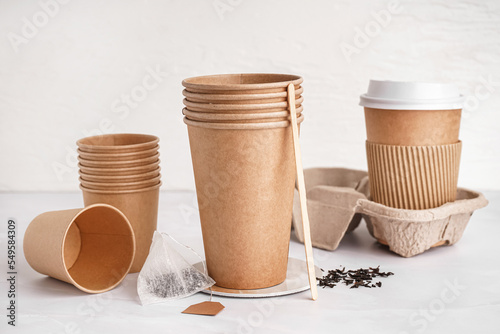 Different paper cups on lig...