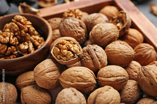 Wooden box with fresh walnuts, closeup