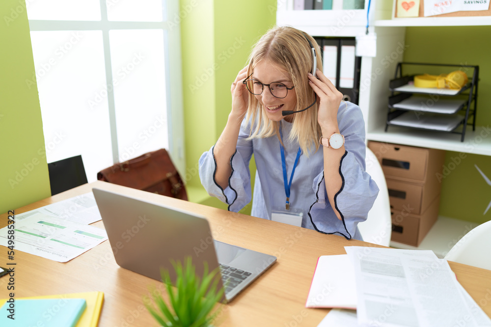 Young blonde woman call center agent smiling confident working at office Young blonde woman call center agent smiling confident working at office