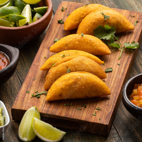 Colombian empanada with spicy sauce - Traditional food from Colombia photo