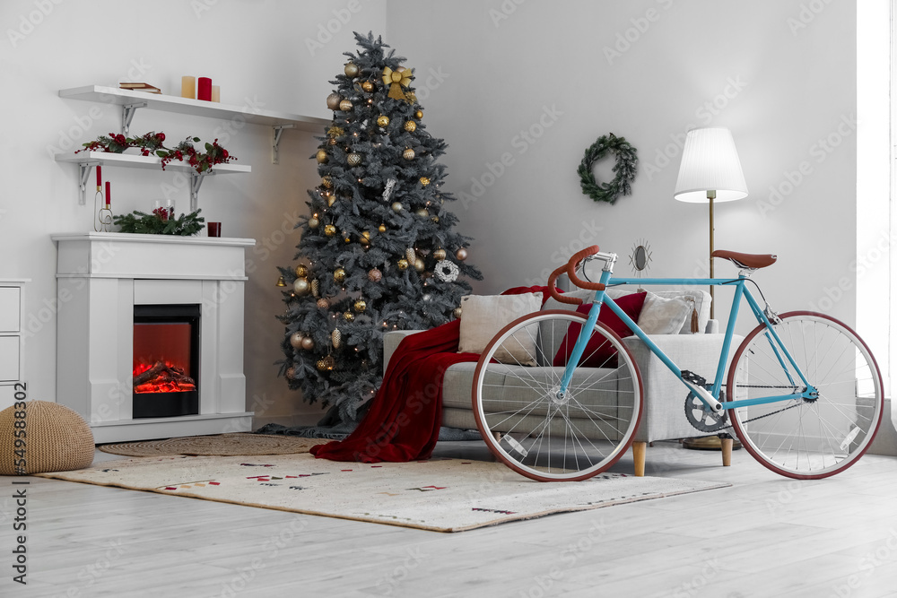 Fototapeta premium Interior of living room with bicycle, sofa and Christmas tree