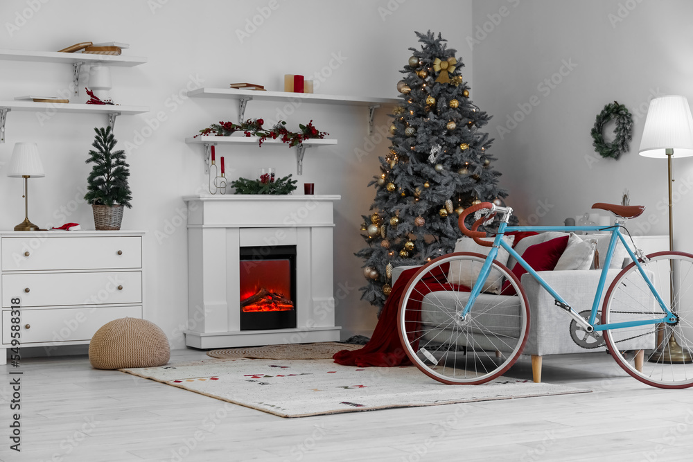 Fototapeta premium Interior of living room with bicycle, sofa and Christmas trees