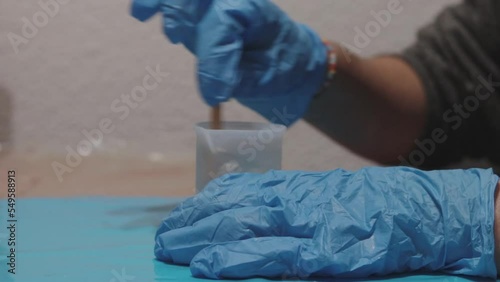person making the epoxy resin mixture