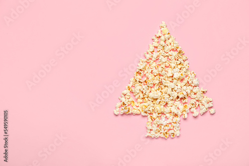 Christmas tree made of popcorn on pink background