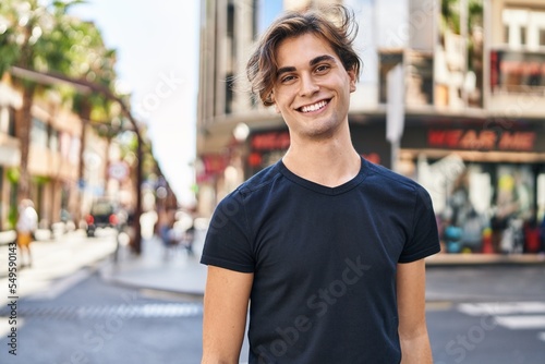 Young caucasian man smiling confident standing at street © Krakenimages.com