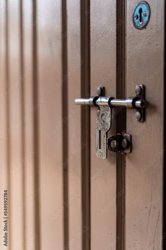 Closeup of metal lock on door in india