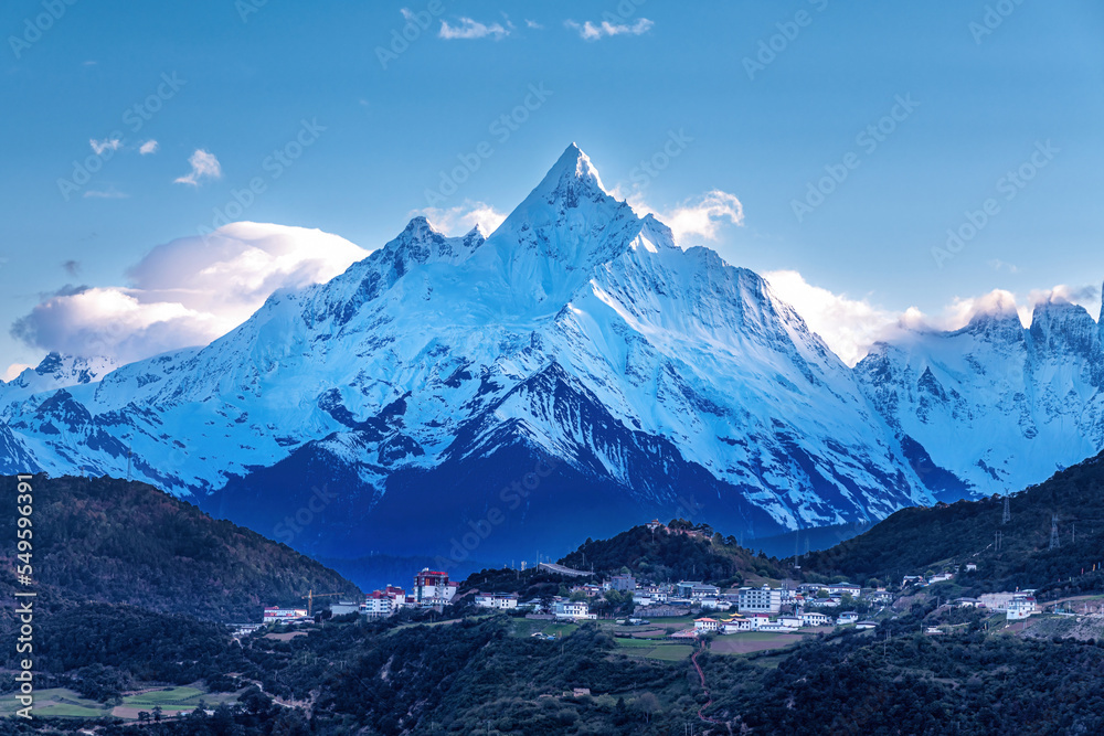 Meri snow mountain and town landscape in Deqen prefecture Yunnan province, China.	
