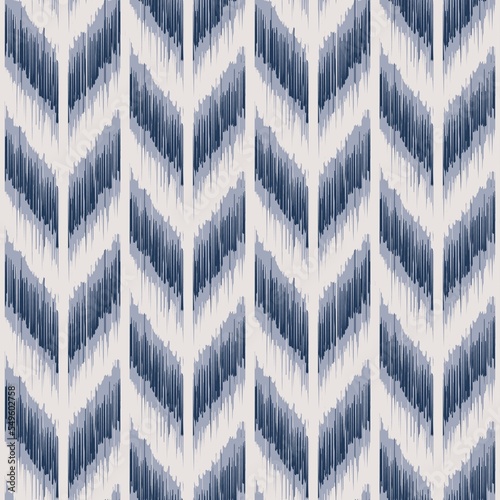 Ikat chevron herringbones pattern. Illustration geometric blue color chevron herringbone pattern ikat style. Ikat seamless pattern for fabric, home interior decoration elements, upholstery, wrapping.