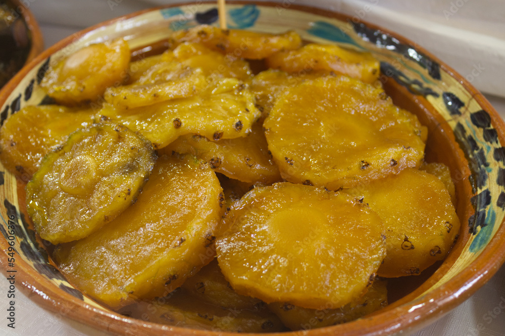 Pineapple fruit in homemade syrup, in a clay pot, a typical Mexican sweet Pineapple fruit in homemade syrup, in a clay pot, a typical Mexican sweet