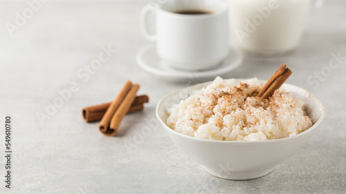  Scandinavian rice porridge in a bowl with cinnamon. Healthy breakfast. Copy space
