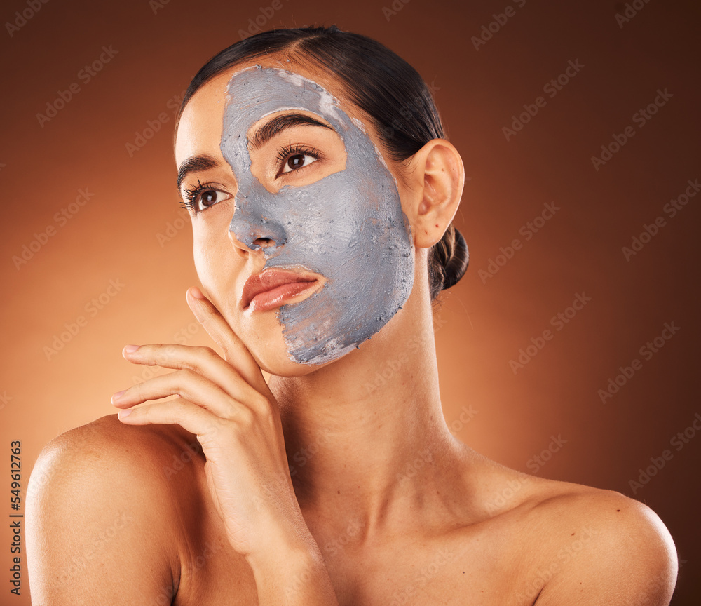 Woman, clay face mask and beauty, facial makeup and detox dermatology on studio background. Female model, skincare product and charcoal cosmetics for shine, natural glow and aesthetic transformation Woman, clay face mask and beauty, facial makeup and detox dermatology on studio background. Female model, skincare product and charcoal cosmetics for shine, natural glow and aesthetic transformation