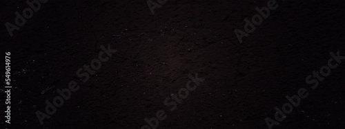 Black and dark gray rough grainy stone and concrete texture background. Wall grunge texture background.