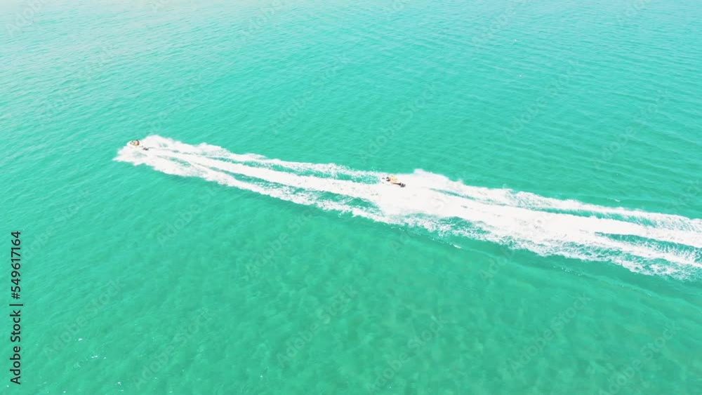Aerial view of a two jet ski fun in turquoise water Aerial view of a two jet ski fun in turquoise water
