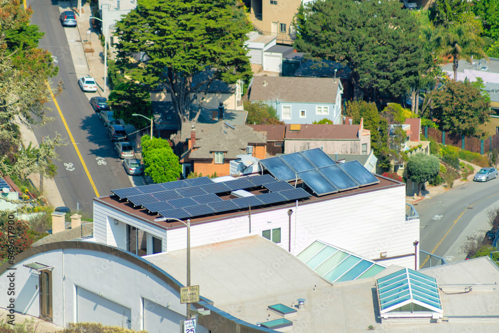 neighborhood with winding road midday in sun