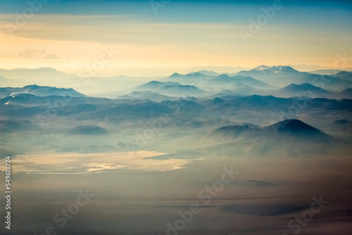 Aerial Atacama desert, snowcapped volcanoes and arid landscape in Chile