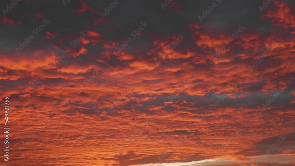 4k time lapse footage of sunset clouds in evening, dramatic red clouds rolling over sky and become darkness at last.