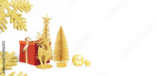 Merry christmas and happy new year celebration concept, golden pine tree and golden christmas ball,riendeer,gift box, object isolated with panoramic banner copy space on white background
