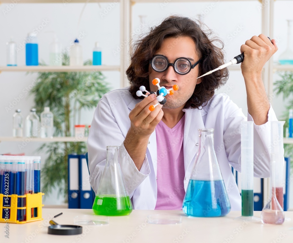 Funny male chemist working in the lab Funny male chemist working in the lab