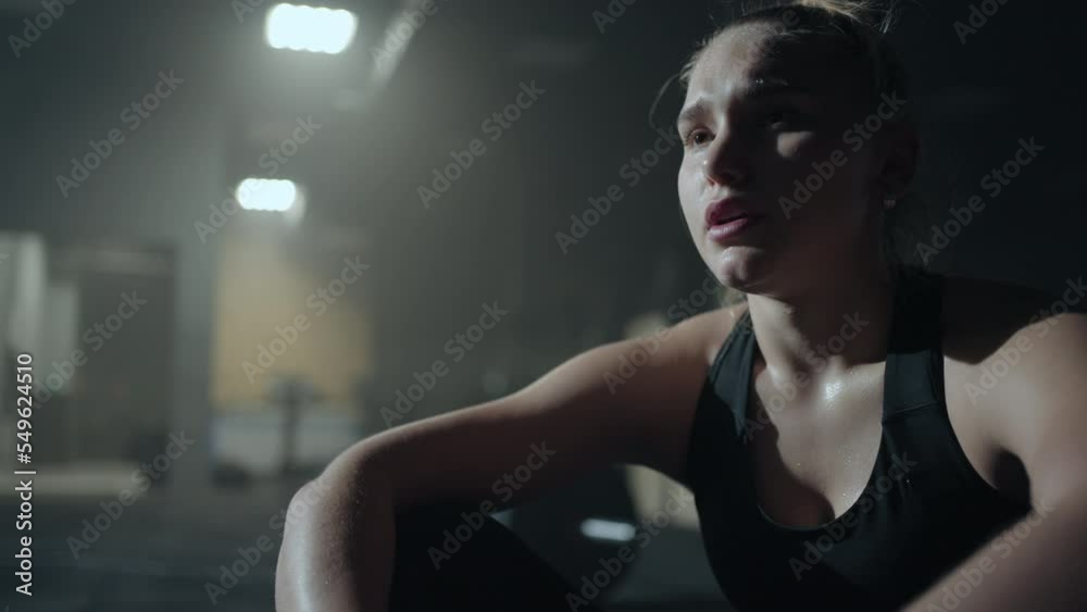 emotional young blonde woman after hard workout in gym, portrait of exhausted sportsperson