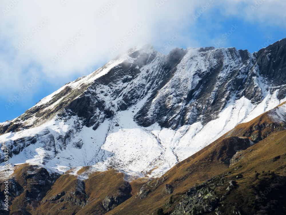 The first autumn snow on the Alpine peak Älplichopf (2641 m) in the Swiss Alps and in the UNESCO World Heritage Tectonic Arena Sardona (UNESCO-Welterbe Tektonikarena Sardona), Vättis - Switzerland The first autumn snow on the Alpine peak Älplichopf (2641 m) in the Swiss Alps and in the UNESCO World Heritage Tectonic Arena Sardona (UNESCO-Welterbe Tektonikarena Sardona), Vättis - Switzerland