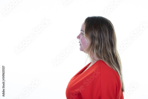plus size pretty blonde woman on profile view looking to copy space ahead side thinking daydreaming