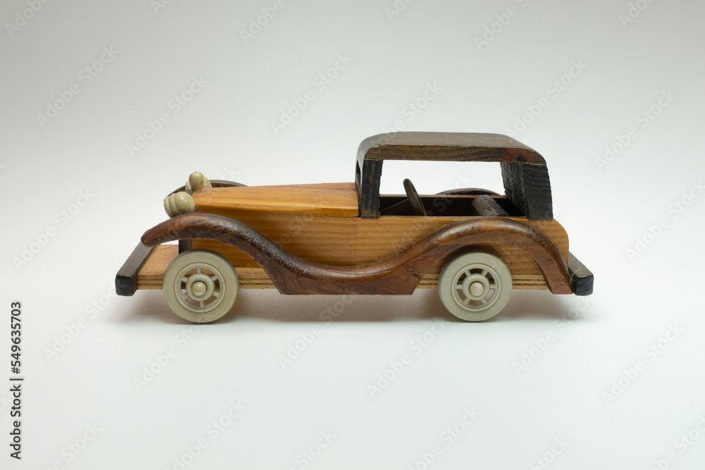 handmade wooden toy car on a white background