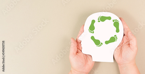 Human head with green co2 footprint, carbon emission, eco friendly lifestyle, climate change and global warming concept 